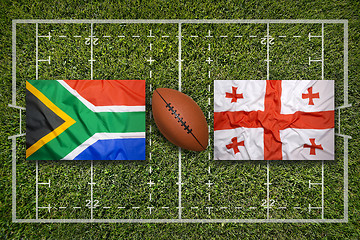 Image showing South Africa vs. Georgia flags on rugby field