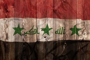 Image showing National flag of Iraq, wooden background
