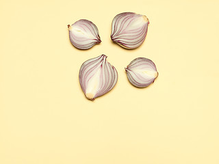 Image showing Red onion on a yellow background