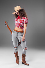 Image showing The cowgirl fashion woman over a gray background