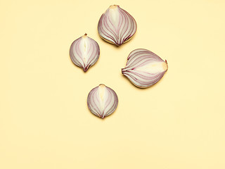 Image showing Red onion on a yellow background