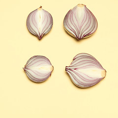 Image showing Red onion on a yellow background