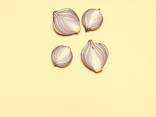 Image showing Red onion on a yellow background
