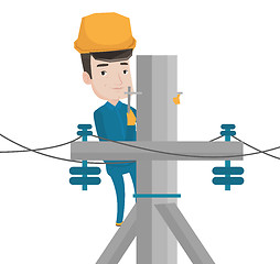 Image showing Electrician working on electric power pole.