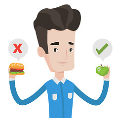 Image showing Man choosing between hamburger and cupcake.