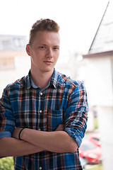 Image showing man standing at balcony