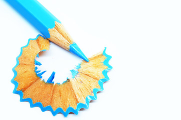 Image showing Sharpened blue color pencil and wood shavings