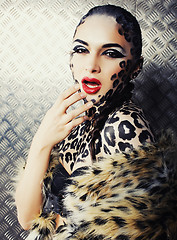 Image showing young sexy woman with leopard make up all over body, cat bodyart