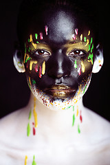 Image showing woman with creative makeup closeup like drops of colors, facepai