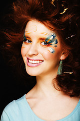 Image showing pretty funny girl with art make up, closeup floral print on face
