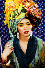 Image showing beauty bright woman with creative make up, many shawls on head l