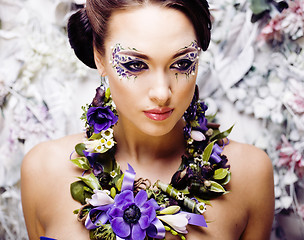 Image showing floral face art with anemone in jewelry, sensual young brunette 