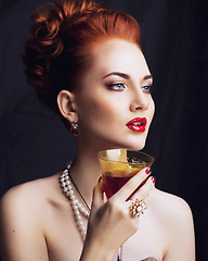 Image showing beauty stylish redhead woman with hairstyle and manicure wearing