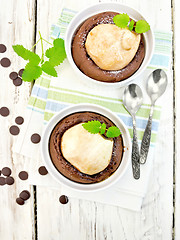 Image showing Cake chocolate with pear in white bowl on light board top