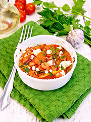 Image showing Shrimp and tomato with feta cheese in bowl on board