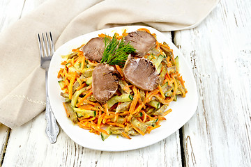 Image showing Salad of tongue and carrots with napkin on board