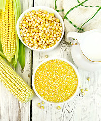 Image showing Corn grits in bowl with milk on board top