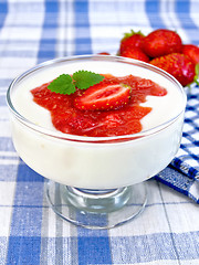 Image showing Dessert milk with strawberry in bowl on towel