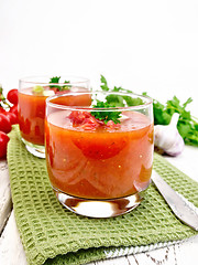 Image showing Soup tomato in two glasses with parsley on light board