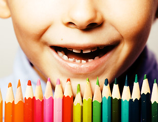 Image showing little cute boy with color pencils close up smiling, education f