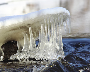 Image showing Icicles over water