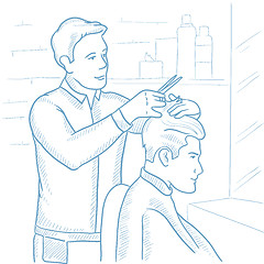 Image showing Barber making haircut to young man.