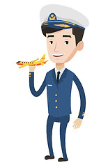 Image showing Cheerful airline pilot with model airplane.