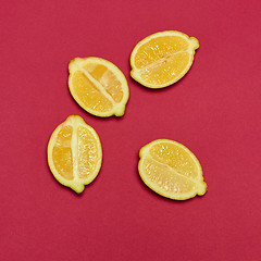 Image showing Lemons on red background