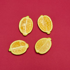 Image showing Lemons on red background