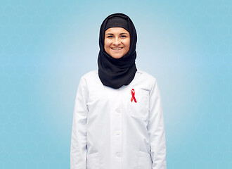 Image showing muslim doctor in hijab with red awareness ribbon