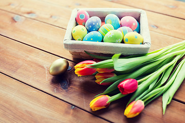 Image showing close up of colored easter eggs and flowers