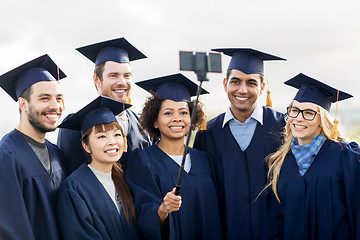 Image showing students or bachelors taking selfie by smartphone