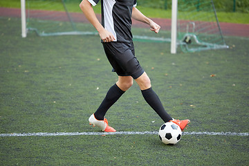 Image showing soccer player playing with ball on football field