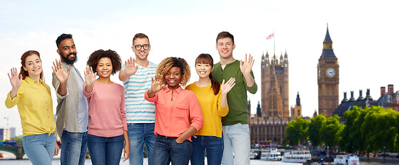 Image showing international people waving hand in london