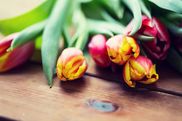 Image showing close up of tulip flowers on wooden table