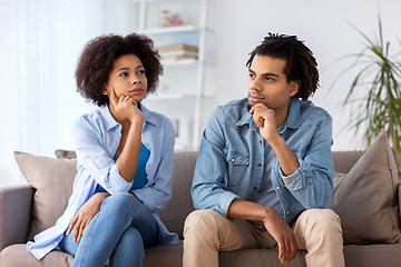 Image showing happy couple sitting on sofa at home