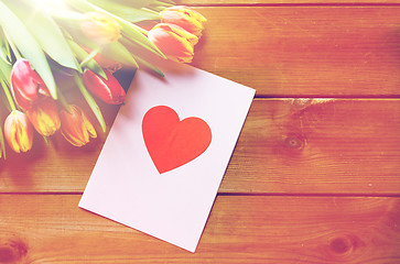 Image showing close up of flowers and greeting card with heart