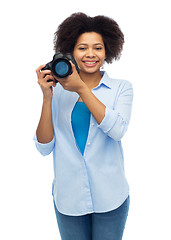 Image showing happy afro american woman with digital camera