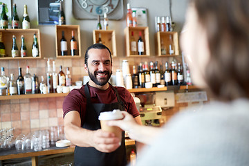 Image showing man or waiter serving customer in coffee shop