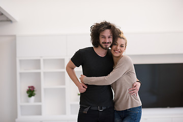 Image showing couple hugging in their new home