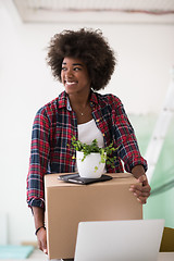 Image showing Black girl moving in the new apartment