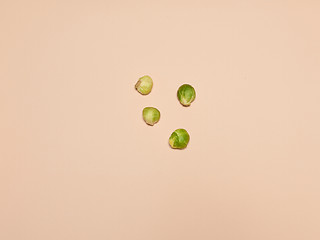 Image showing The piles of Brussels sprouts on a pink background