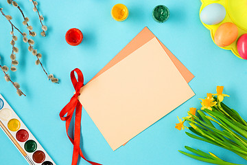 Image showing The top view of easter on blue table office workplace