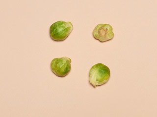 Image showing The piles of Brussels sprouts on a pink background