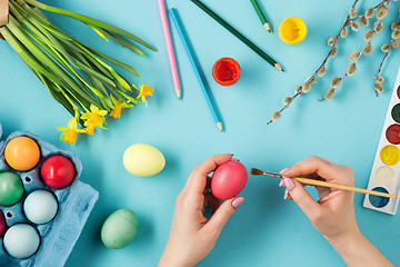 Image showing The top view of easter on blue table office workplace