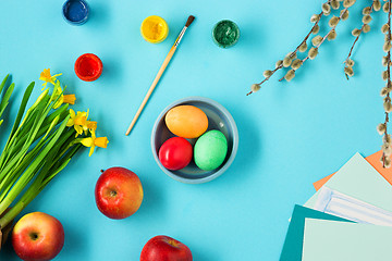 Image showing The top view of easter on blue table office workplace