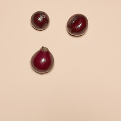 Image showing Red onion on a pink background