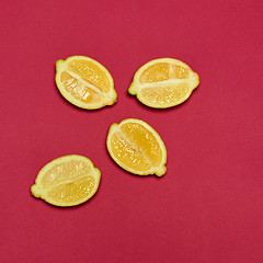 Image showing Lemons on red background