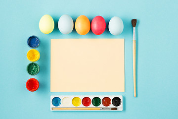 Image showing The top view of easter on blue table office workplace