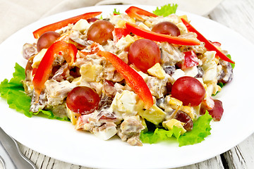 Image showing Salad of meat and cheese with grapes on green lettuce